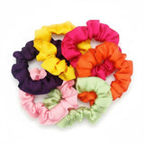 Oversized satin scrunchie in deep jewel tone with rich glossy finish