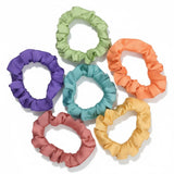 Smooth lustrous satin hair tie for polished hairstyles